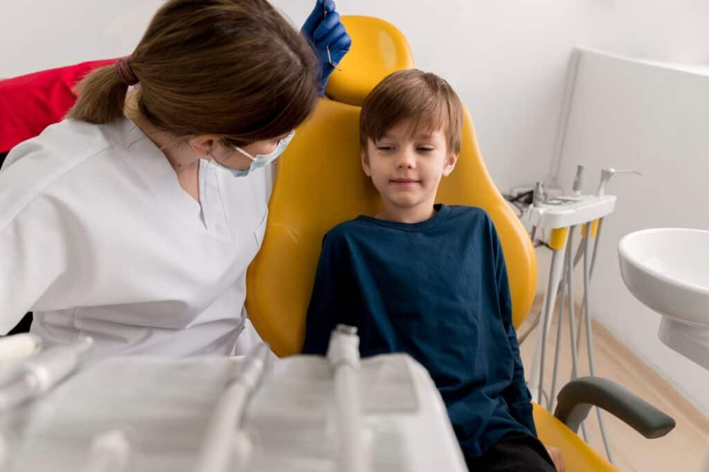 Dentist Treating Her Child Patient