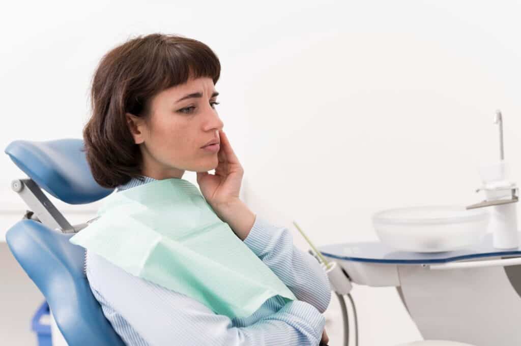 Young Women Suffering Tooth Extraction Complications